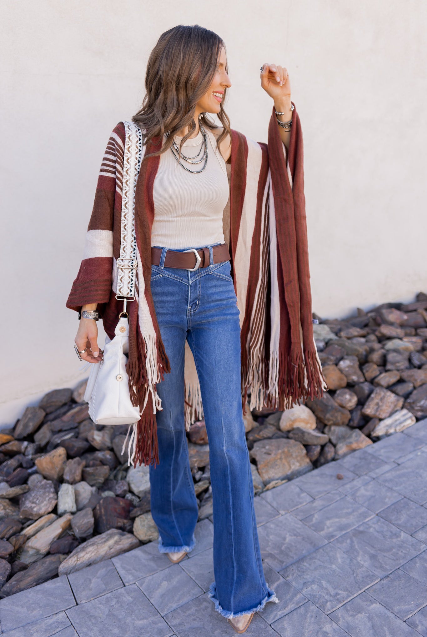 Woman in boho cardigan and jeans
