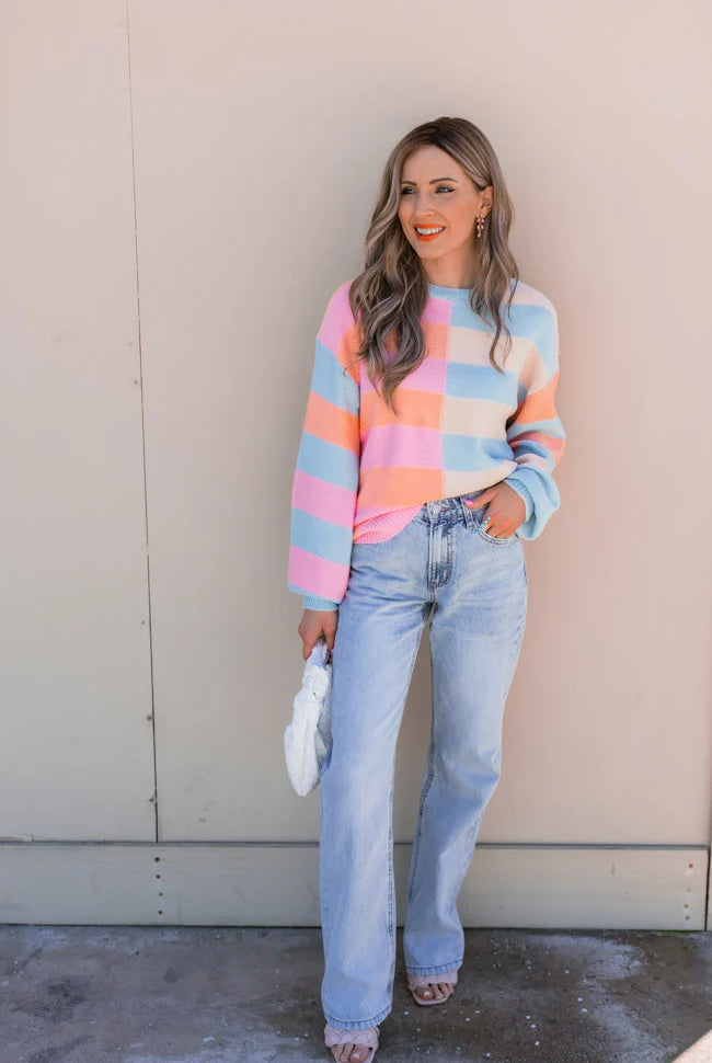 Woman in 008A3808 pastel sweater and jeans