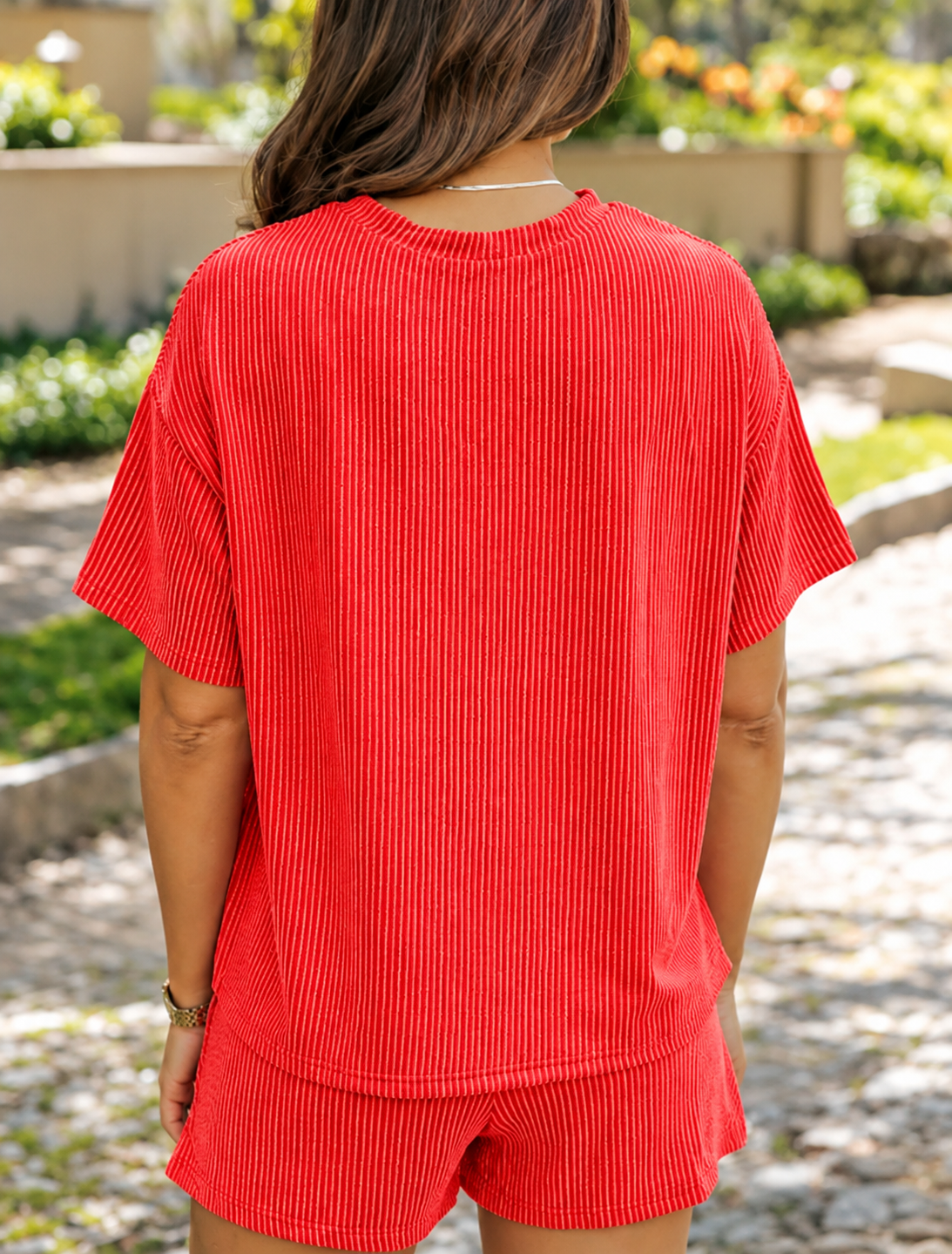 Sunlit Garden Path in Red Knit Outfit.png