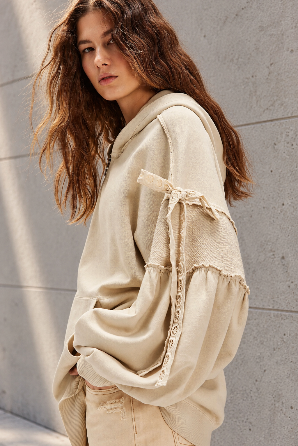 Voluminous Beige Hoodie Editorial Portrait.png