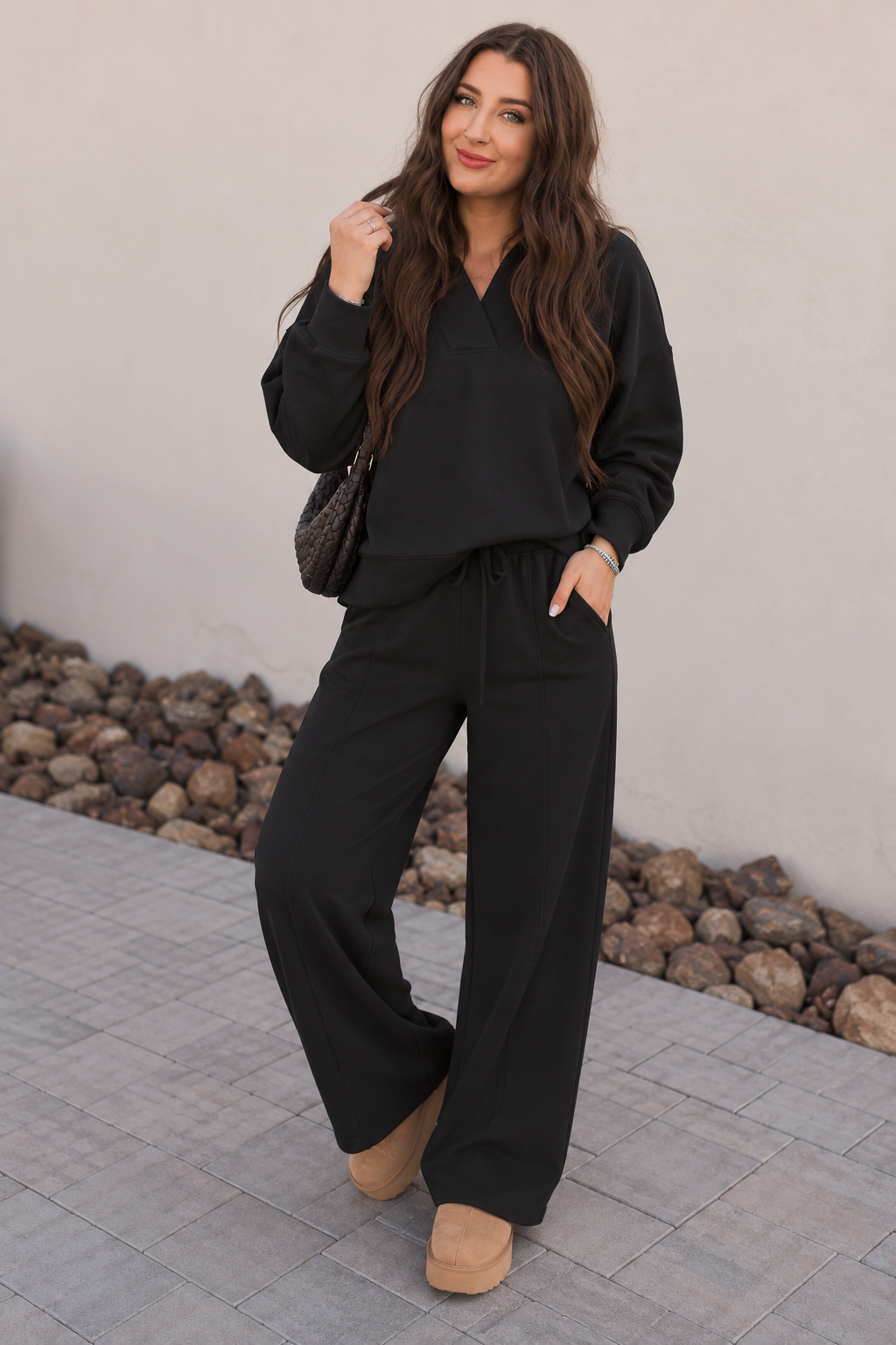 Chic Black Loungewear Against Stucco.png