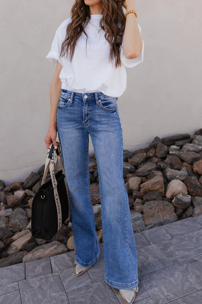 Woman in wide leg jeans and white tee outfit