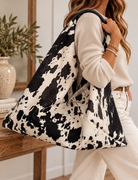 Cow-Print Tote in a Cozy Interior.png