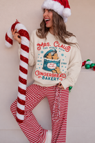Festive Mrs. Claus Gingerbread Bakery Portrait.png