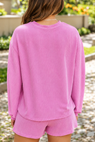 Pink Ribbed Lounge Set in Blooming Garden.png