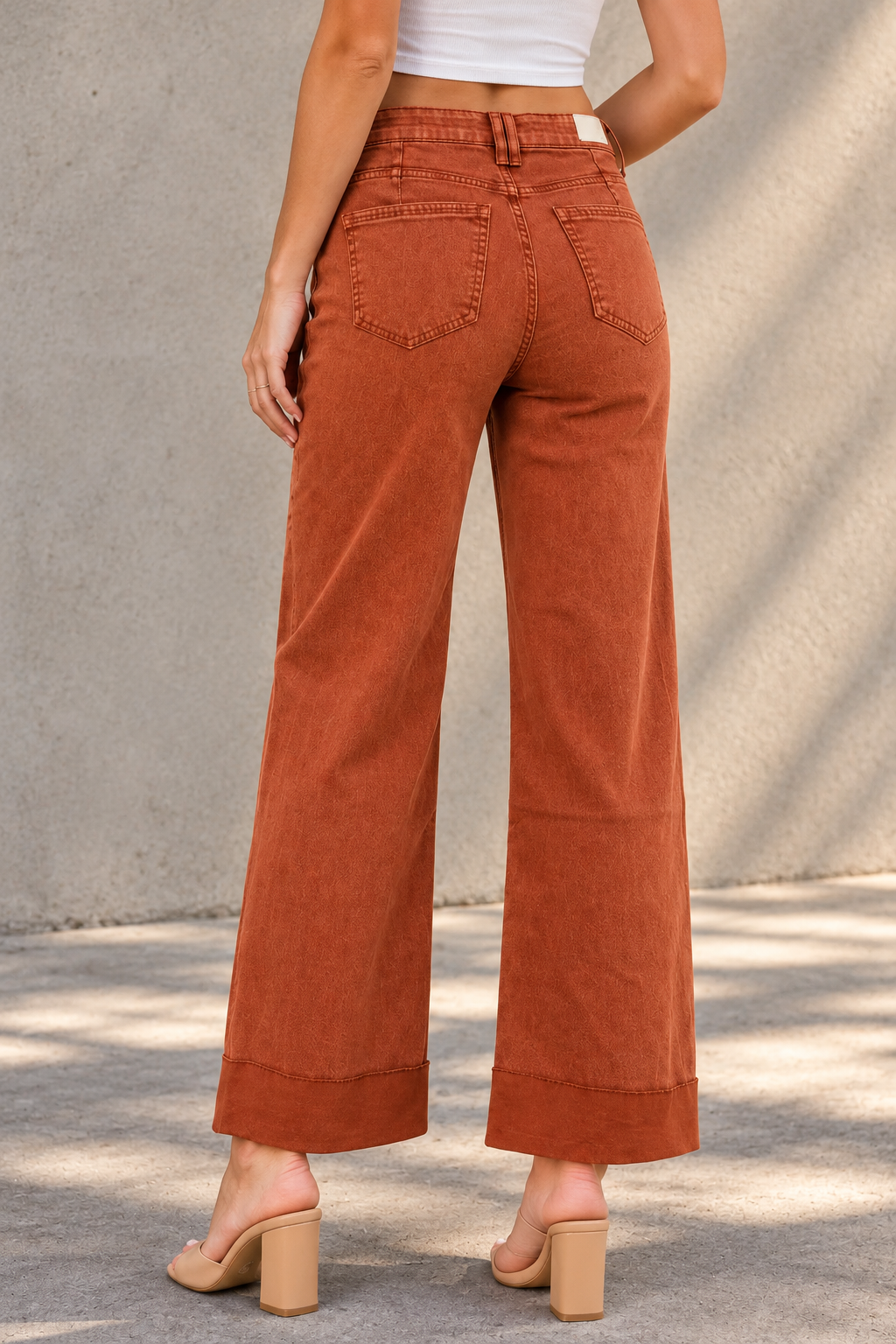 Rust Jeans Against Concrete.png