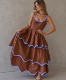 Scalloped Blue-Trimmed Brown Dress.png