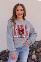 Smiling in a Christmas Season Sweatshirt.png