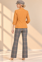 Tailored Plaid Elegance in Warm Studio Light.png