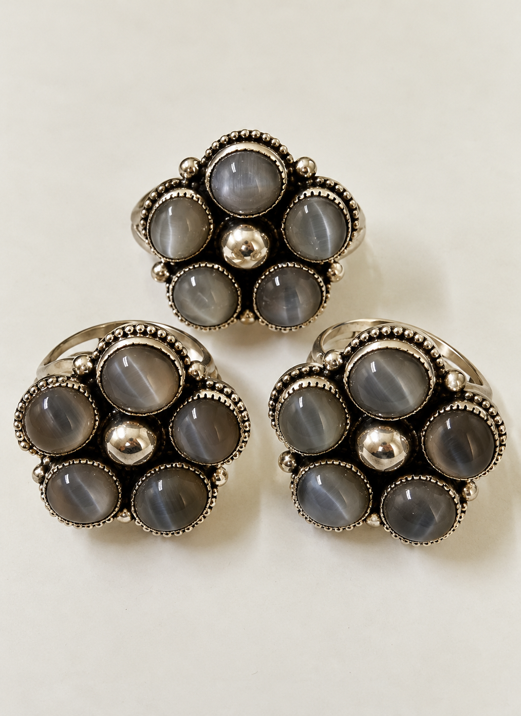 Three Silver Cat’s-Eye Flower Rings.png