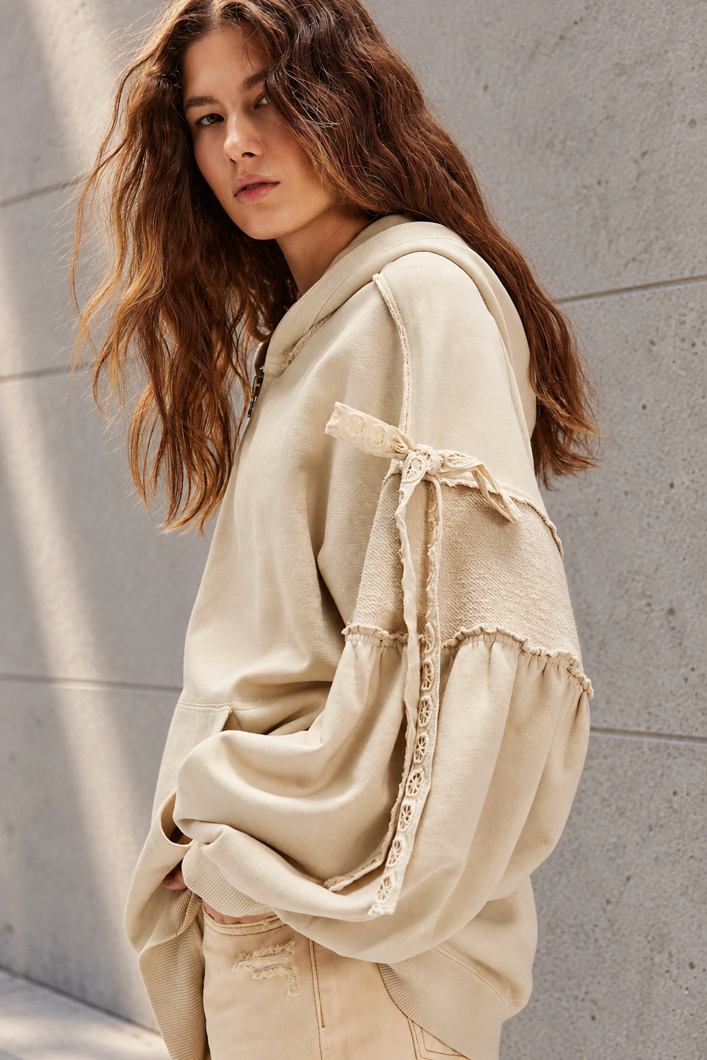 Voluminous Beige Hoodie Editorial Portrait.png
